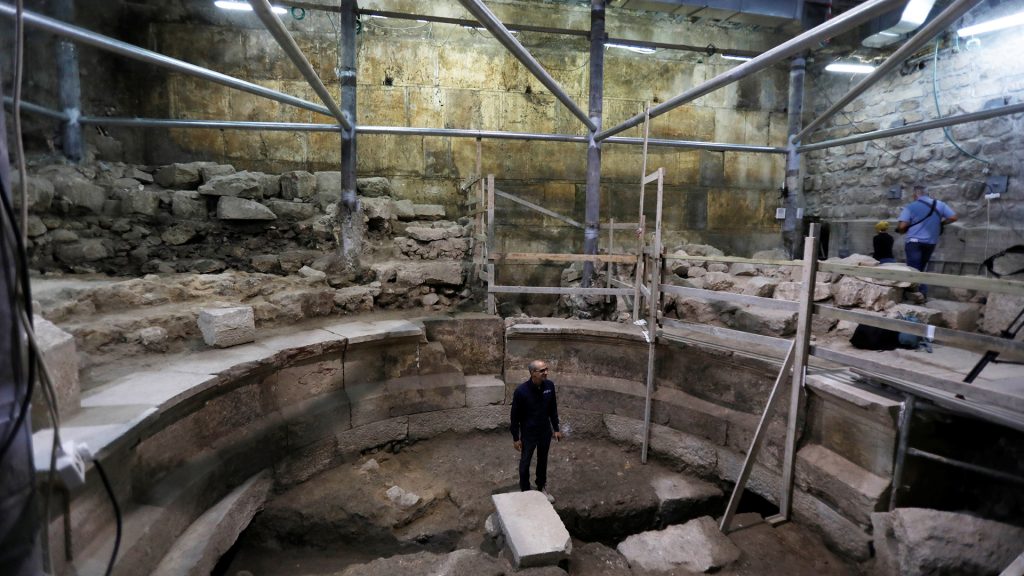 Israel Antiquities Authority archaeologist Dr. Joe Uziel stands inside a theatre-like structure during a media tour to reveal the structure which was discovered during excavation works underneath Wilson's Arch in the Western Wall tunnels in Jerusalem's Old City October 16, 2017. REUTERS/Ronen Zvulun